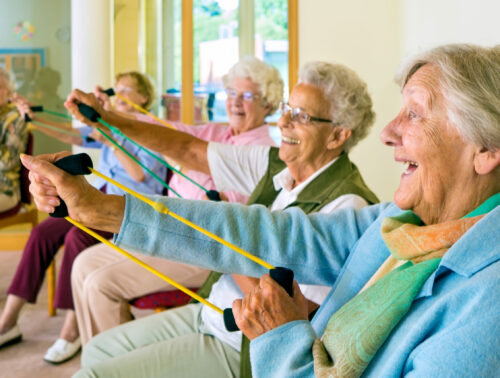 Large,Group,Of,Happy,Enthusiastic,Elderly,Ladies,Exercising,In,A